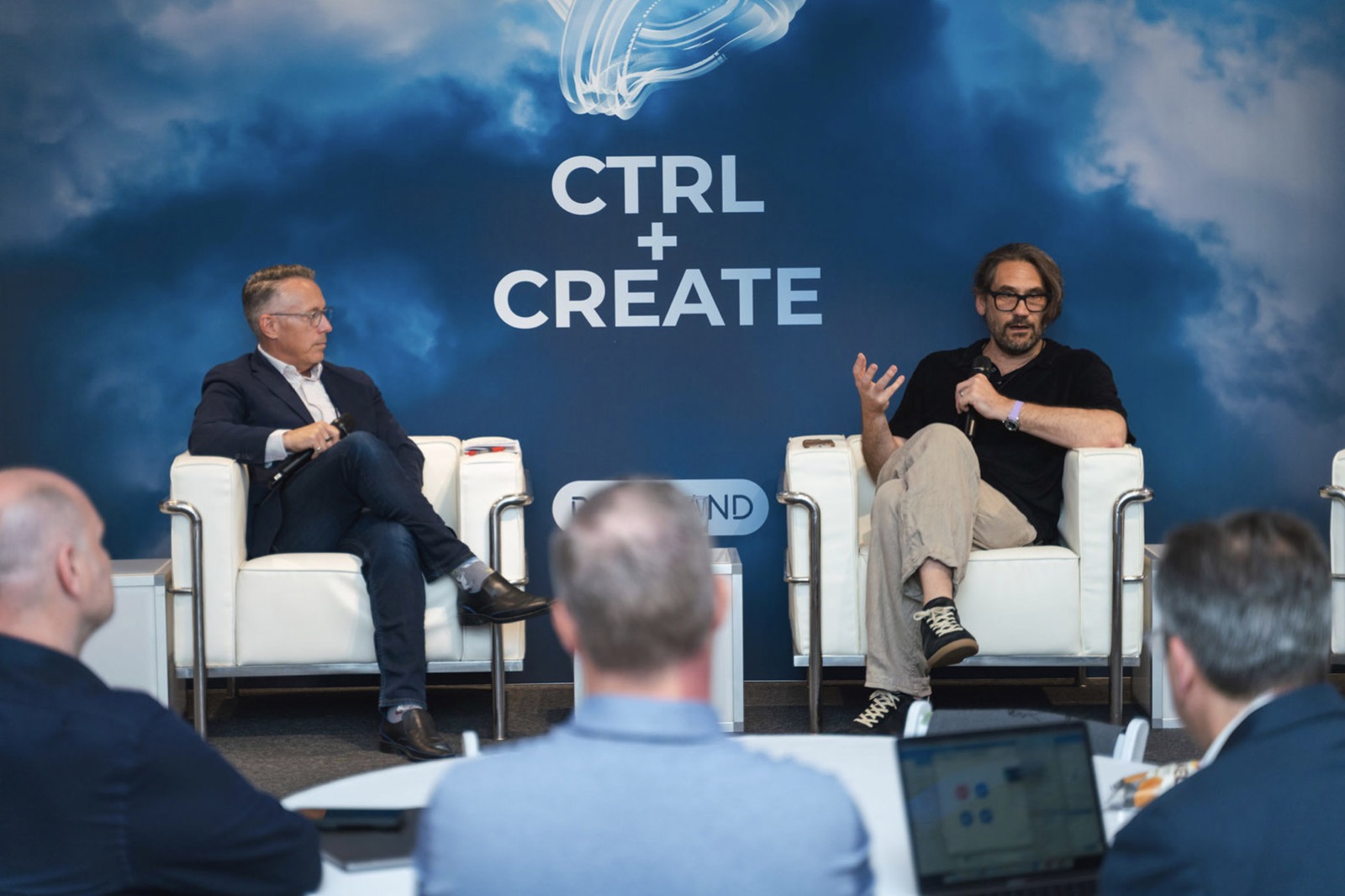 CTRL Create event speakers on stage with branded backdrop