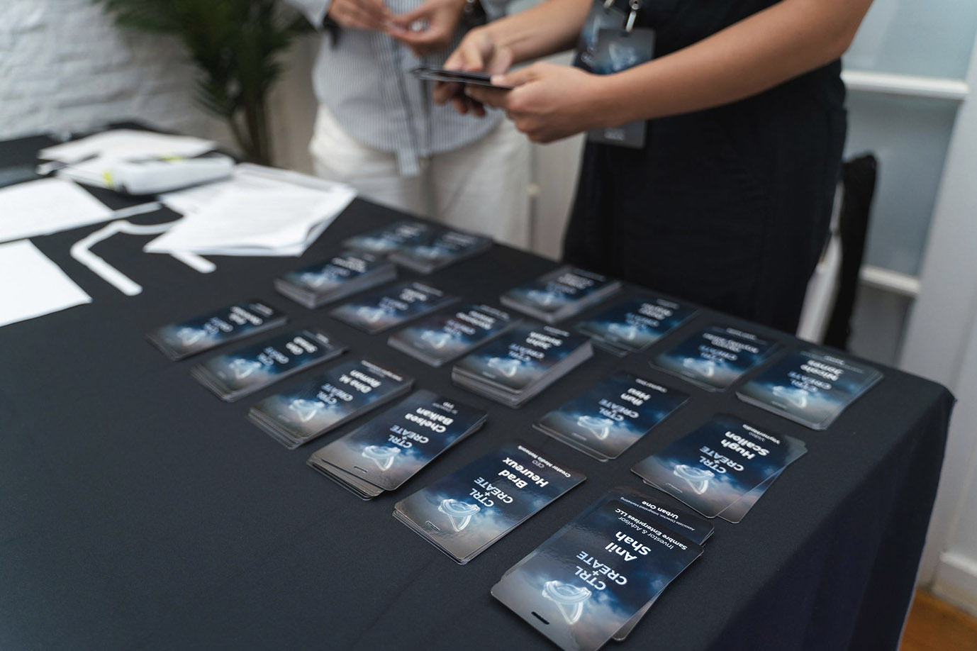Printed event badges arranged on a check-in table